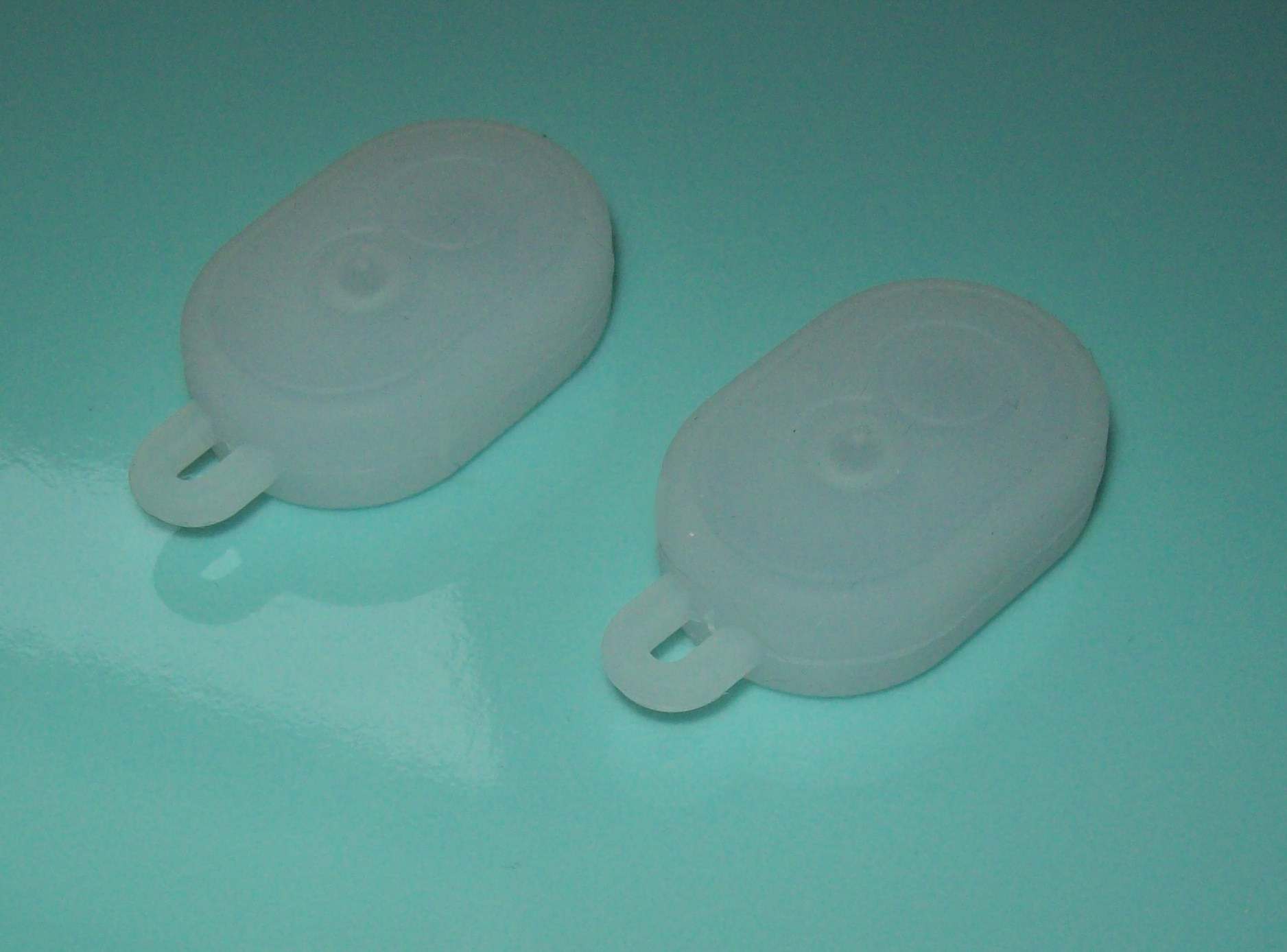 Sprutsikker silikonholder for sporingsbrikke